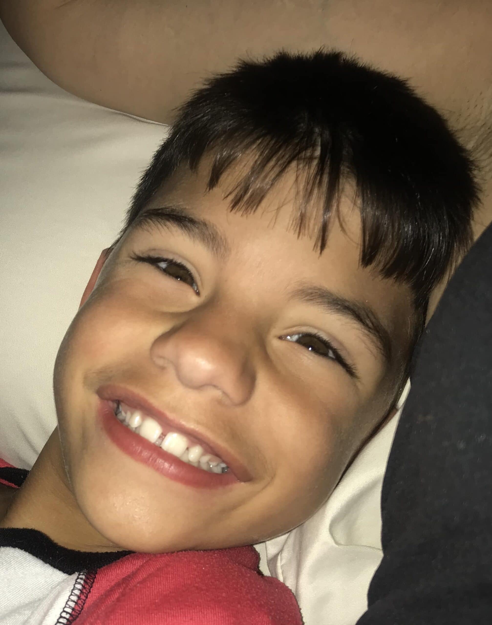 Smiling kid looking at camera